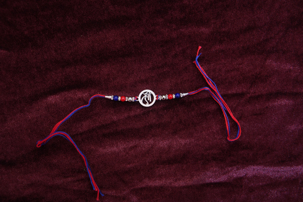 Silver Rakhi with Roli Chawal
