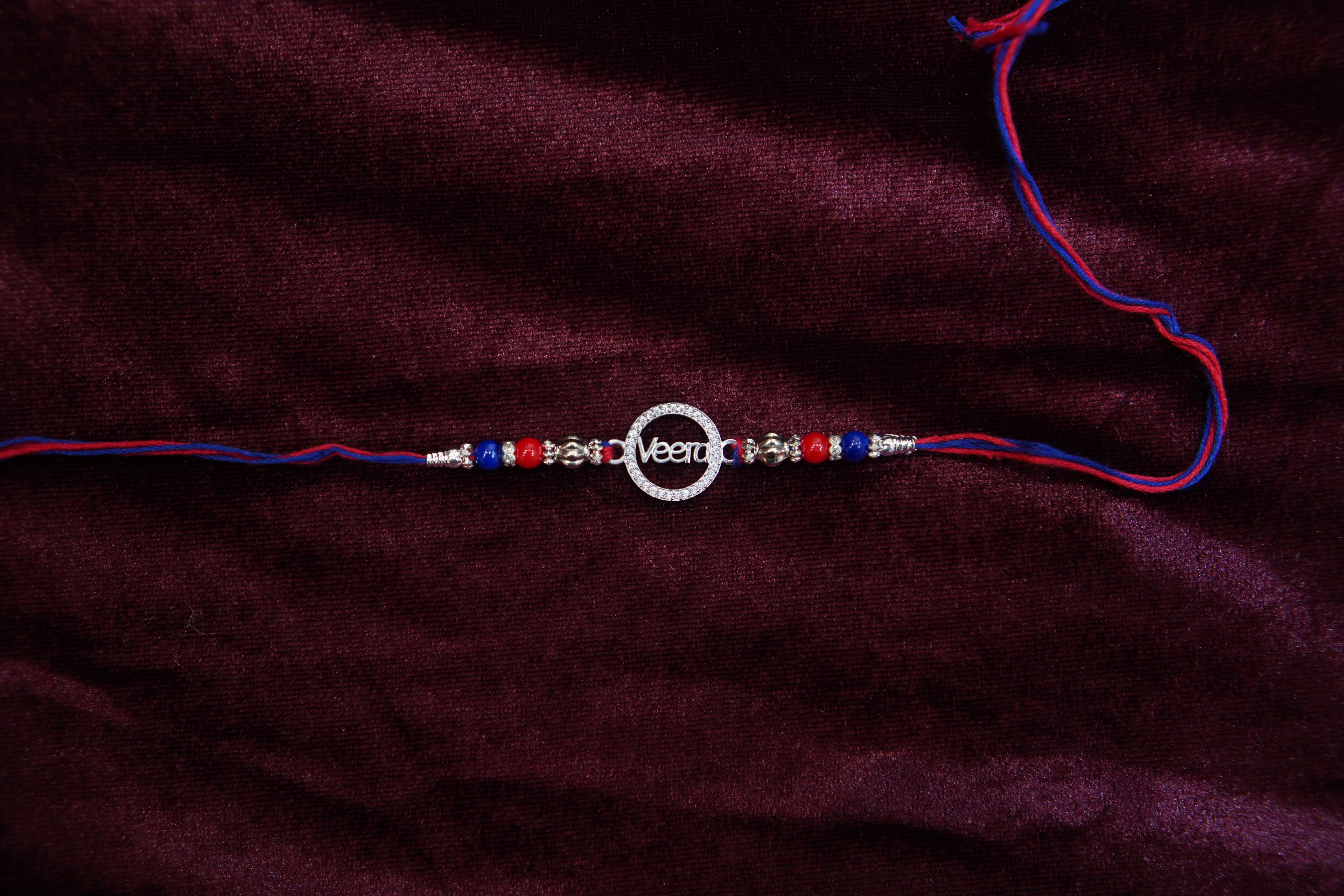 Silver Rakhi with Roli Chawal