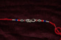 Silver Rakhi with Roli Chawal
