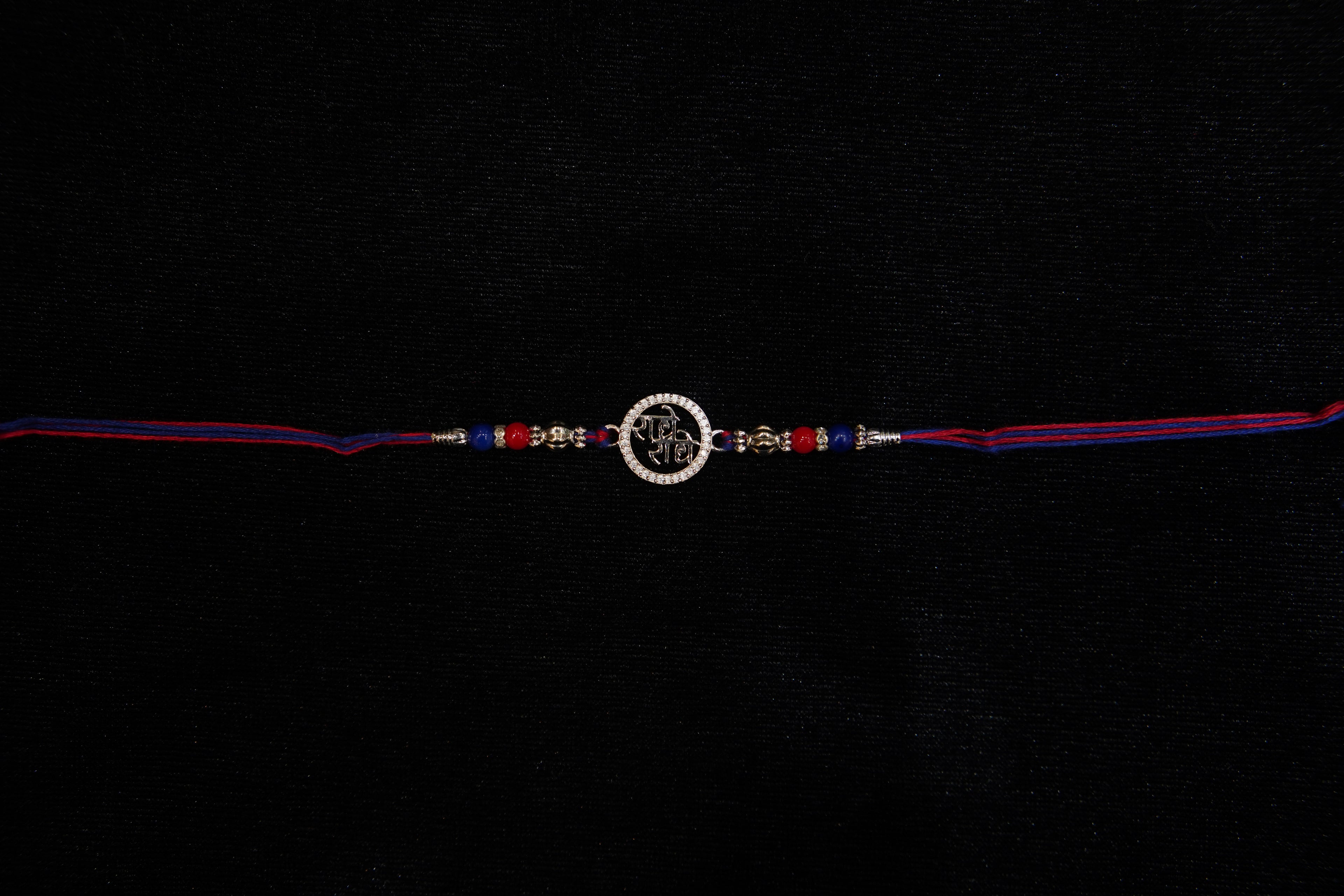 Silver Rakhi with Roli Chawal