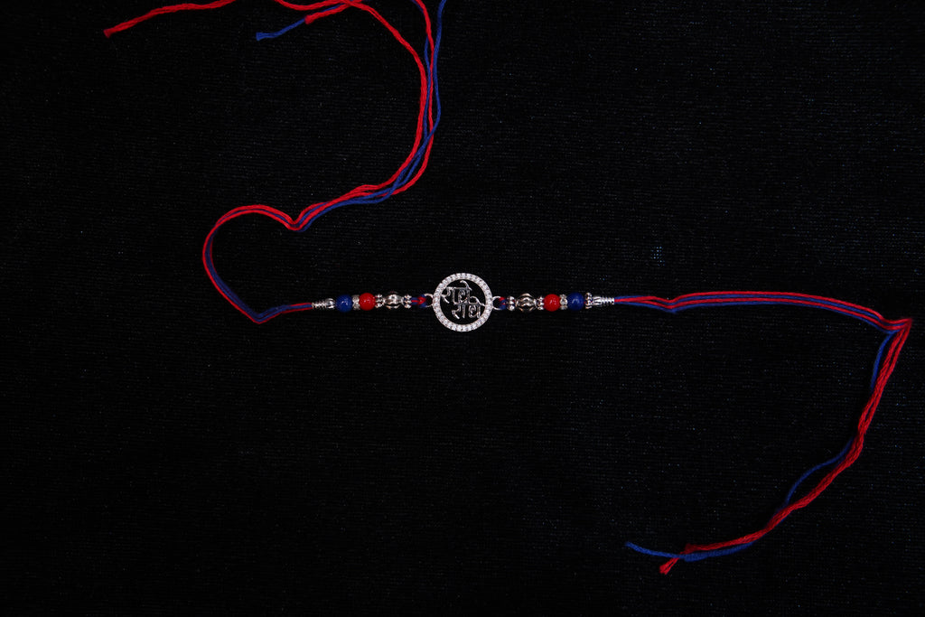 Silver Rakhi with Roli Chawal