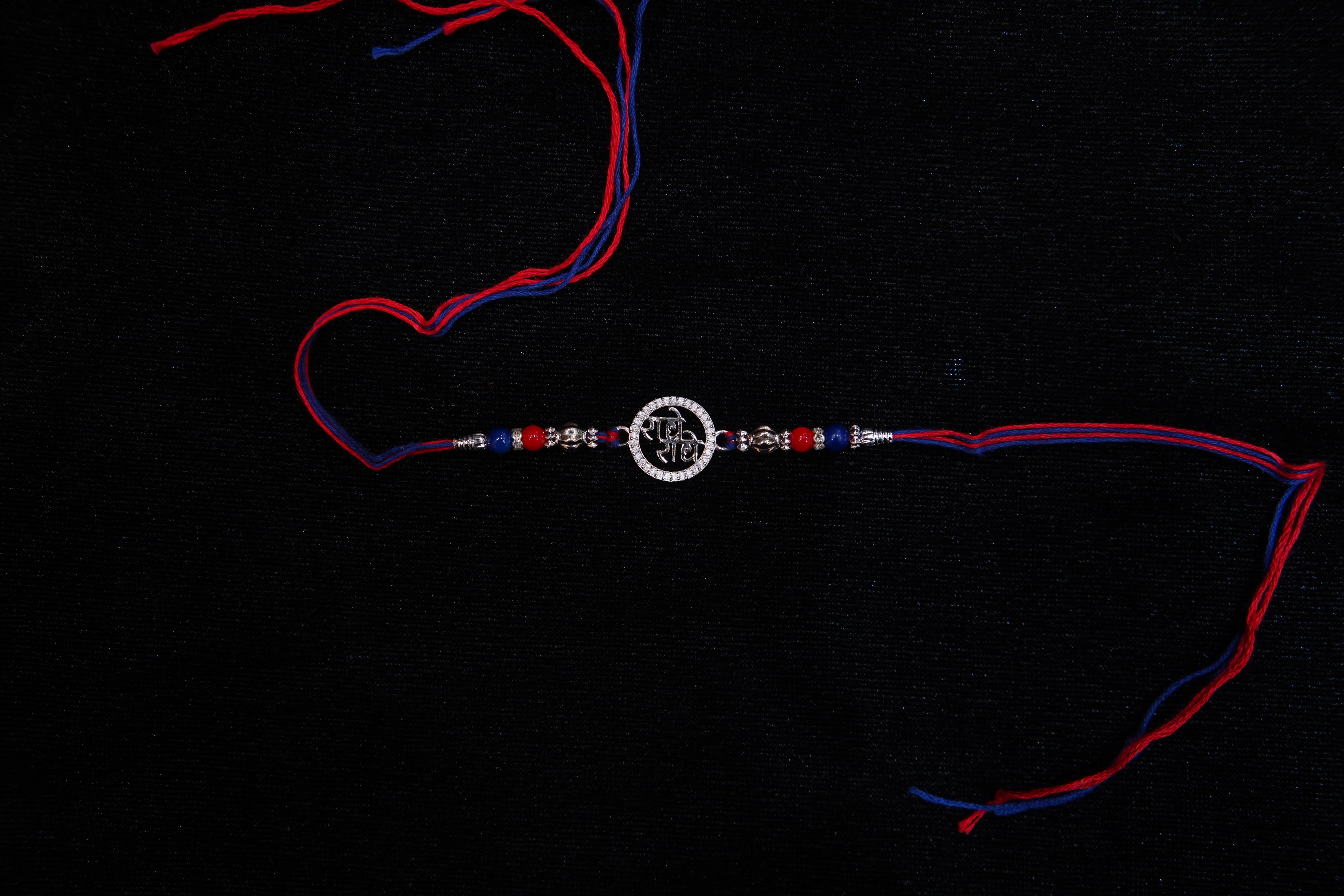 Silver Rakhi with Roli Chawal