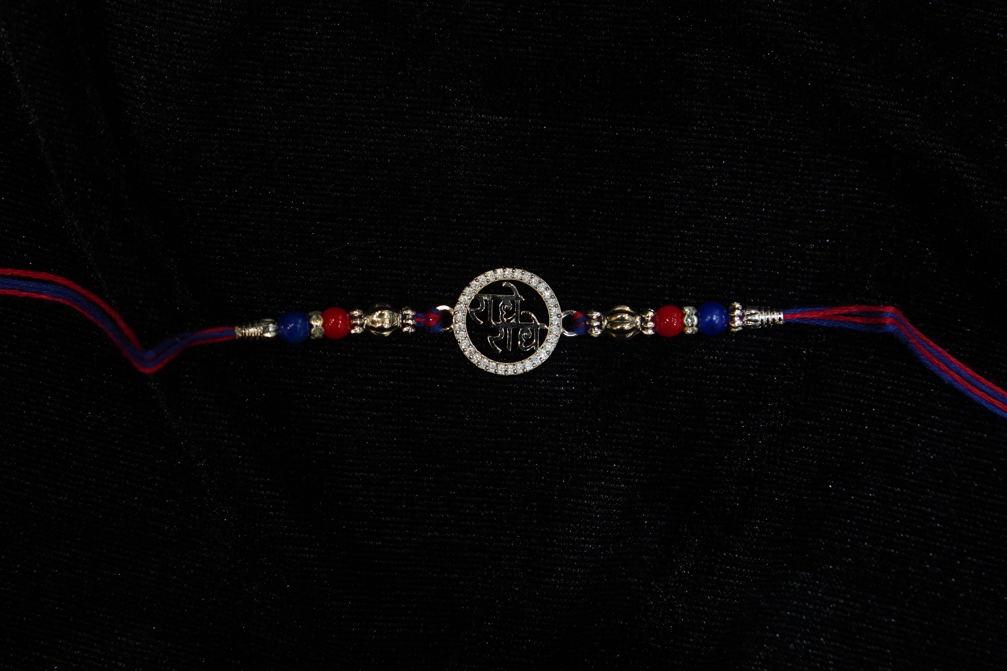 Silver Rakhi with Roli Chawal