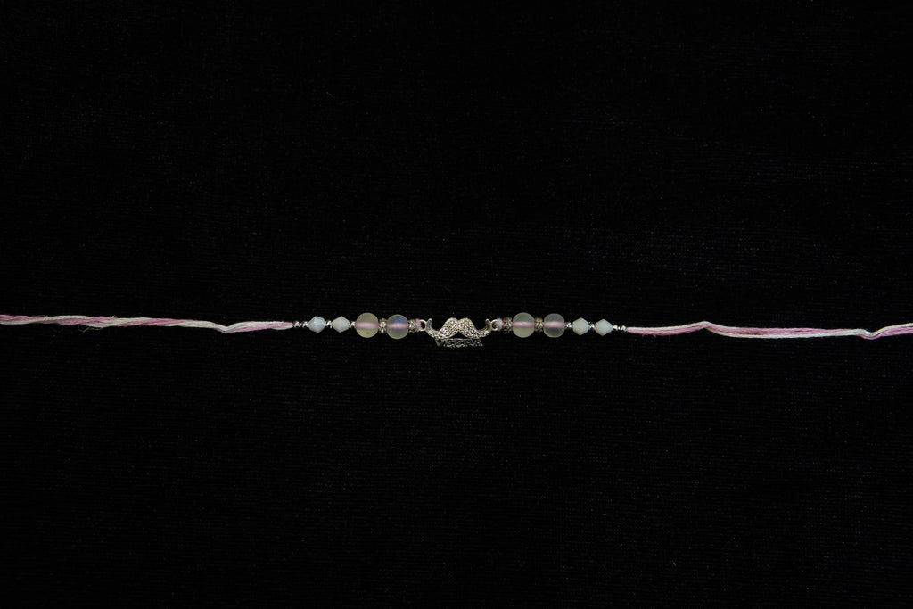 Silver Rakhi with Roli Chawal