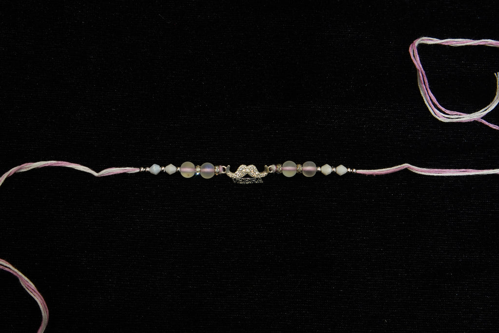 Silver Rakhi with Roli Chawal