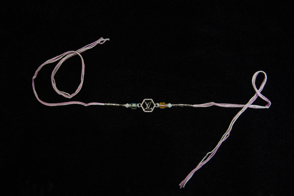 Silver Rakhi with Roli Chawal