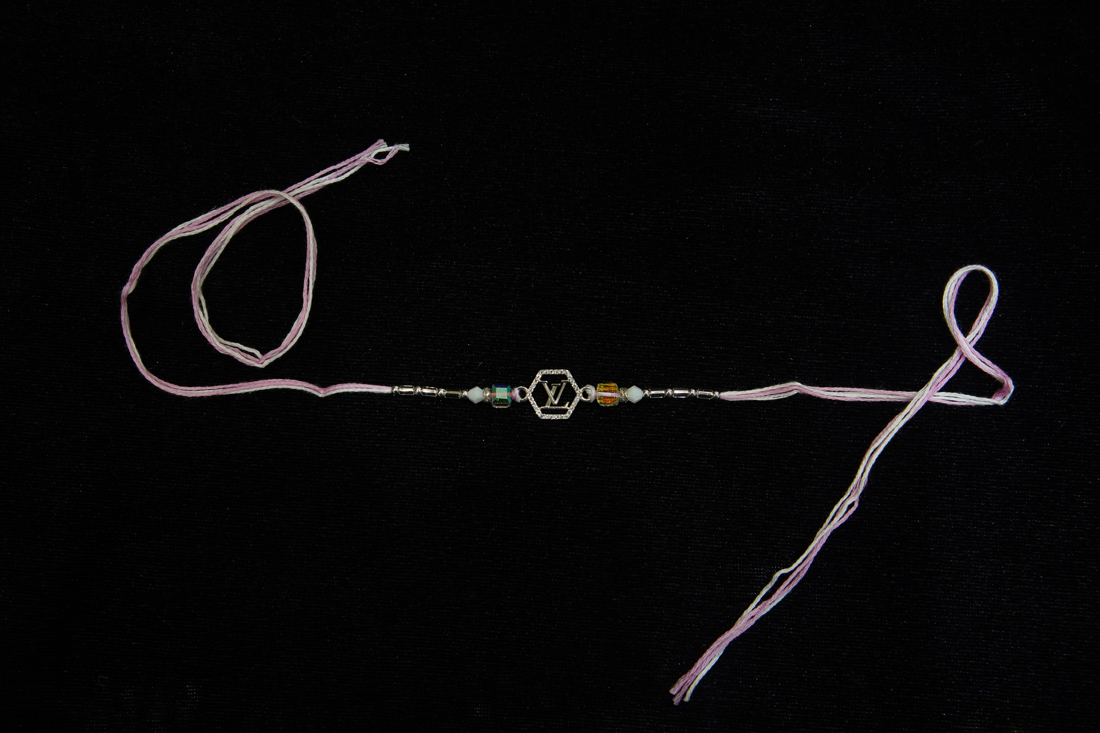 Silver Rakhi with Roli Chawal