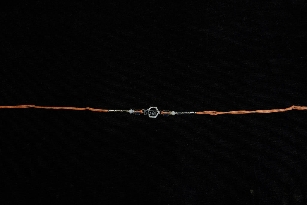 Silver Rakhi with Roli Chawal