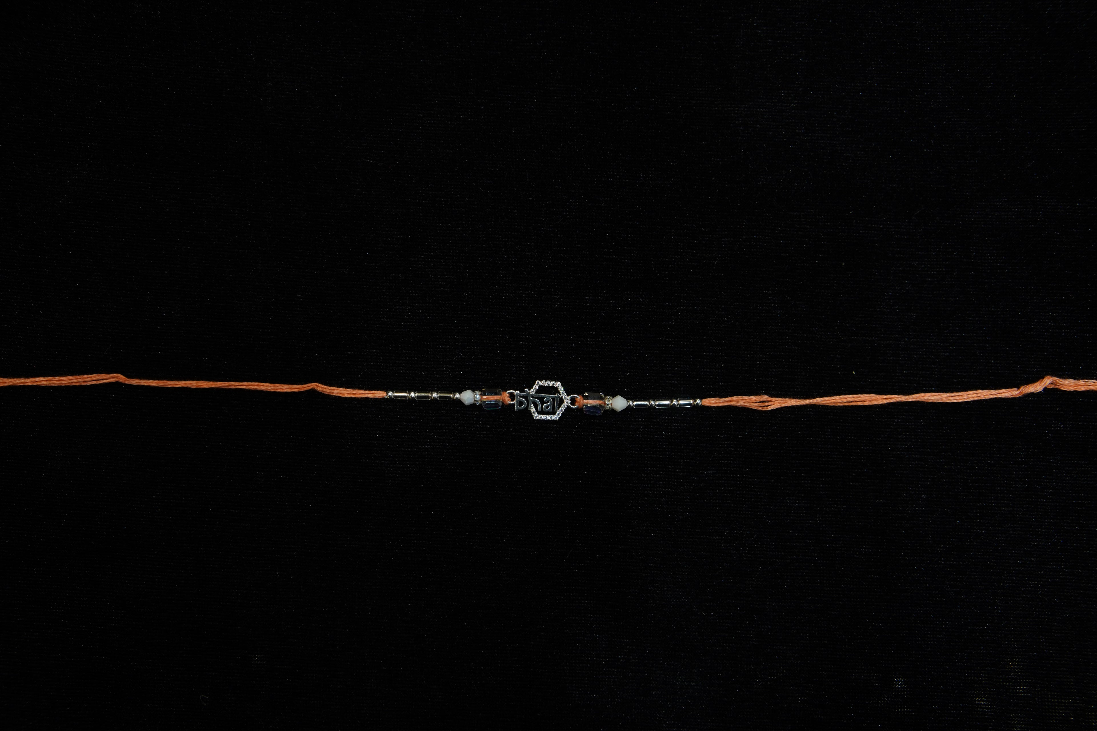 Silver Rakhi with Roli Chawal