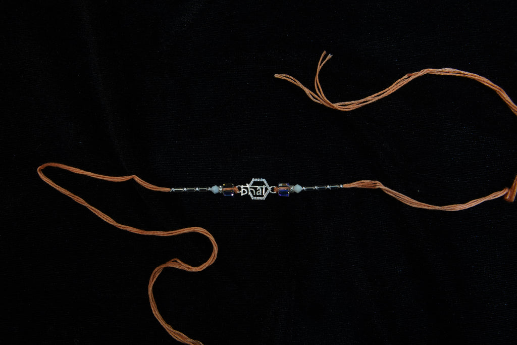 Silver Rakhi with Roli Chawal