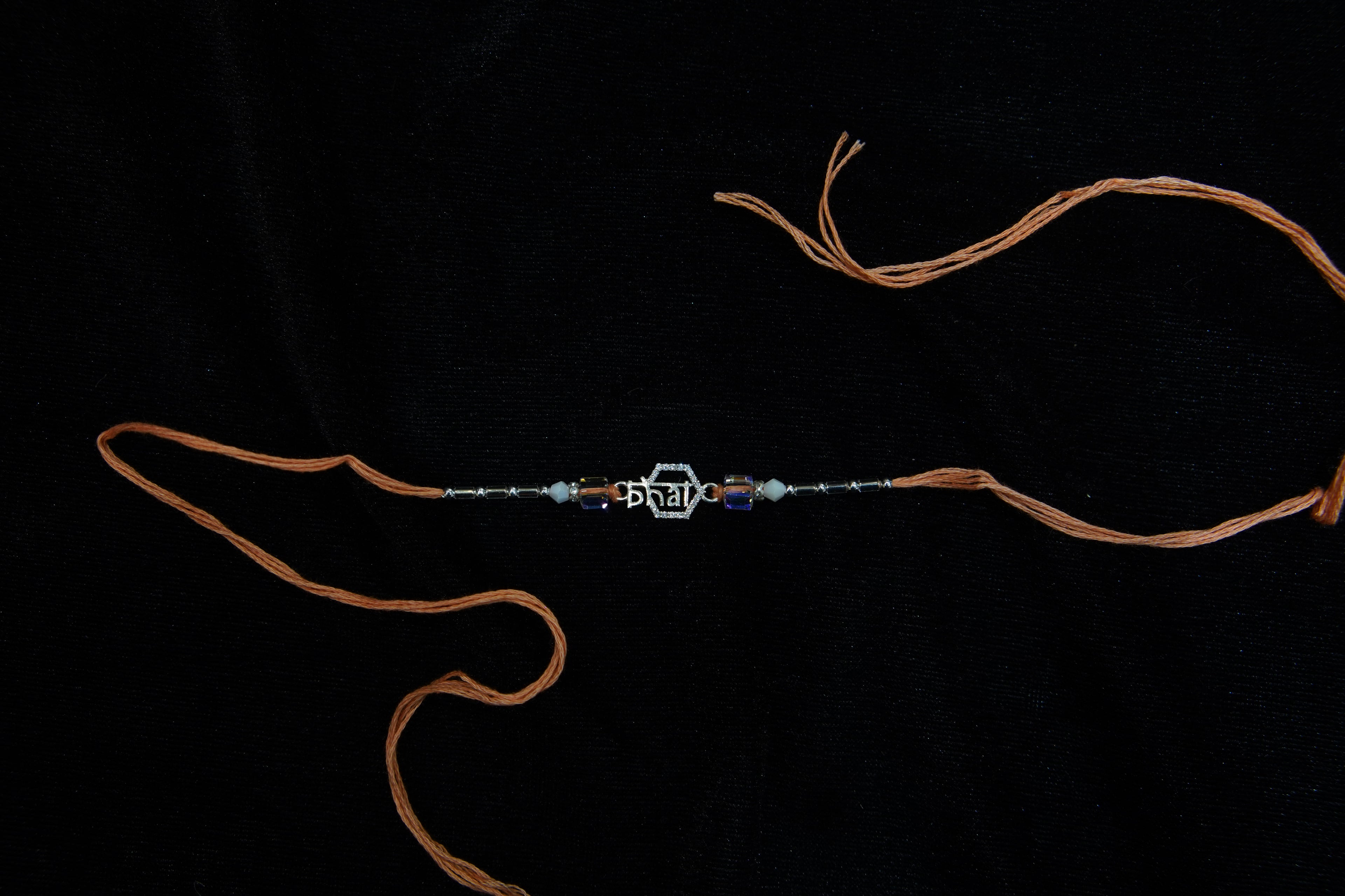 Silver Rakhi with Roli Chawal