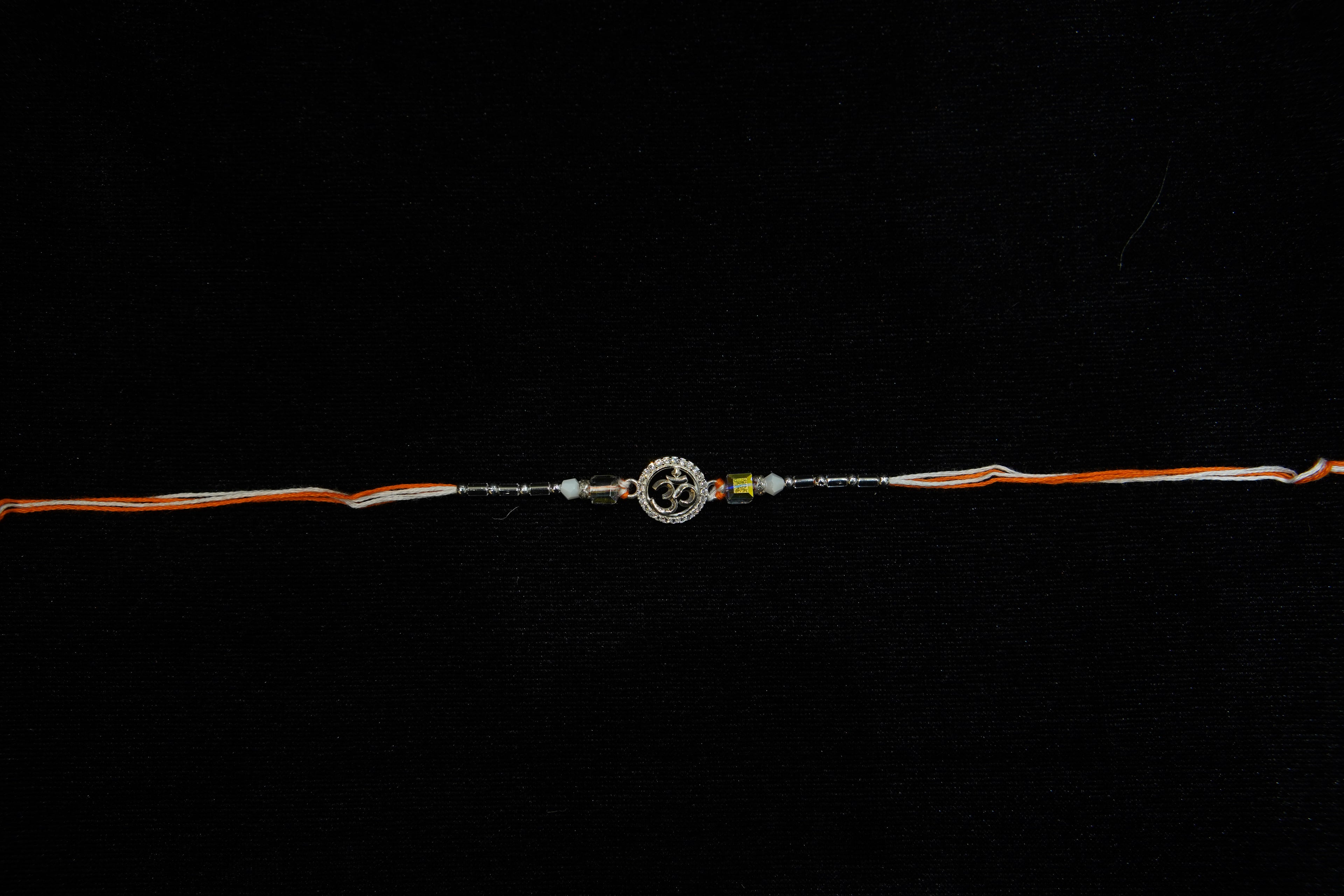 Silver Rakhi with Roli Chawal