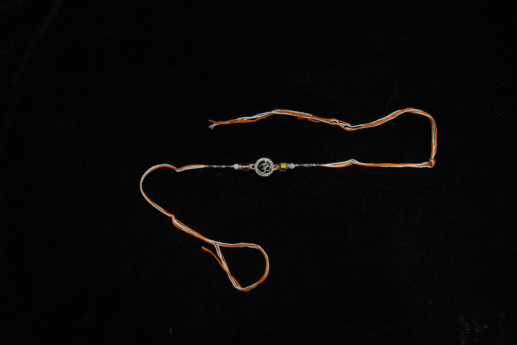 Silver Rakhi with Roli Chawal