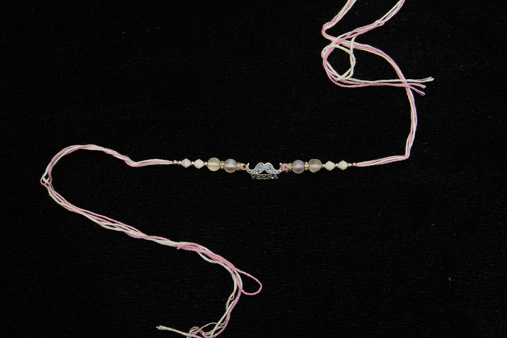 Silver Rakhi with Roli Chawal