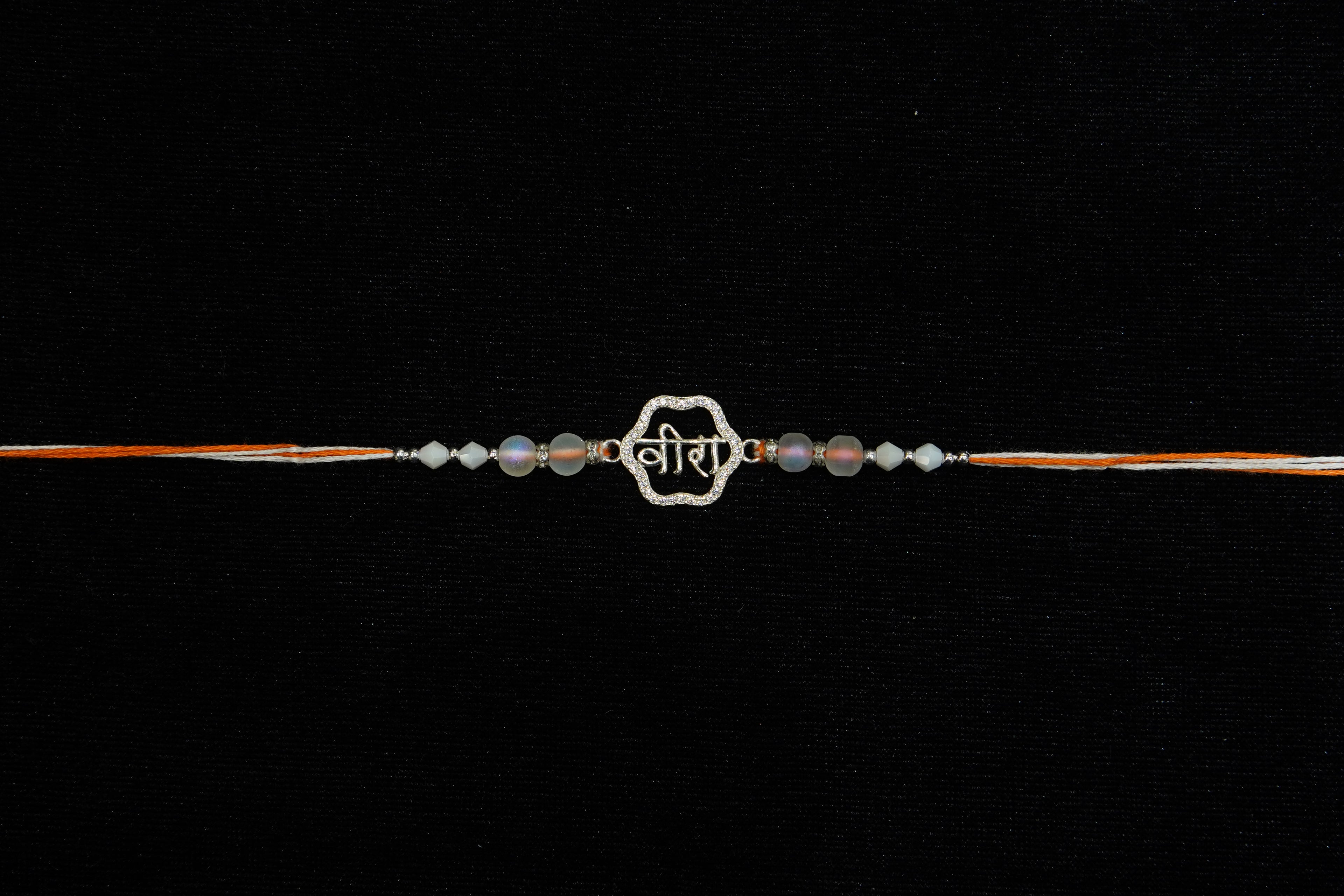 Silver Rakhi with Roli Chawal