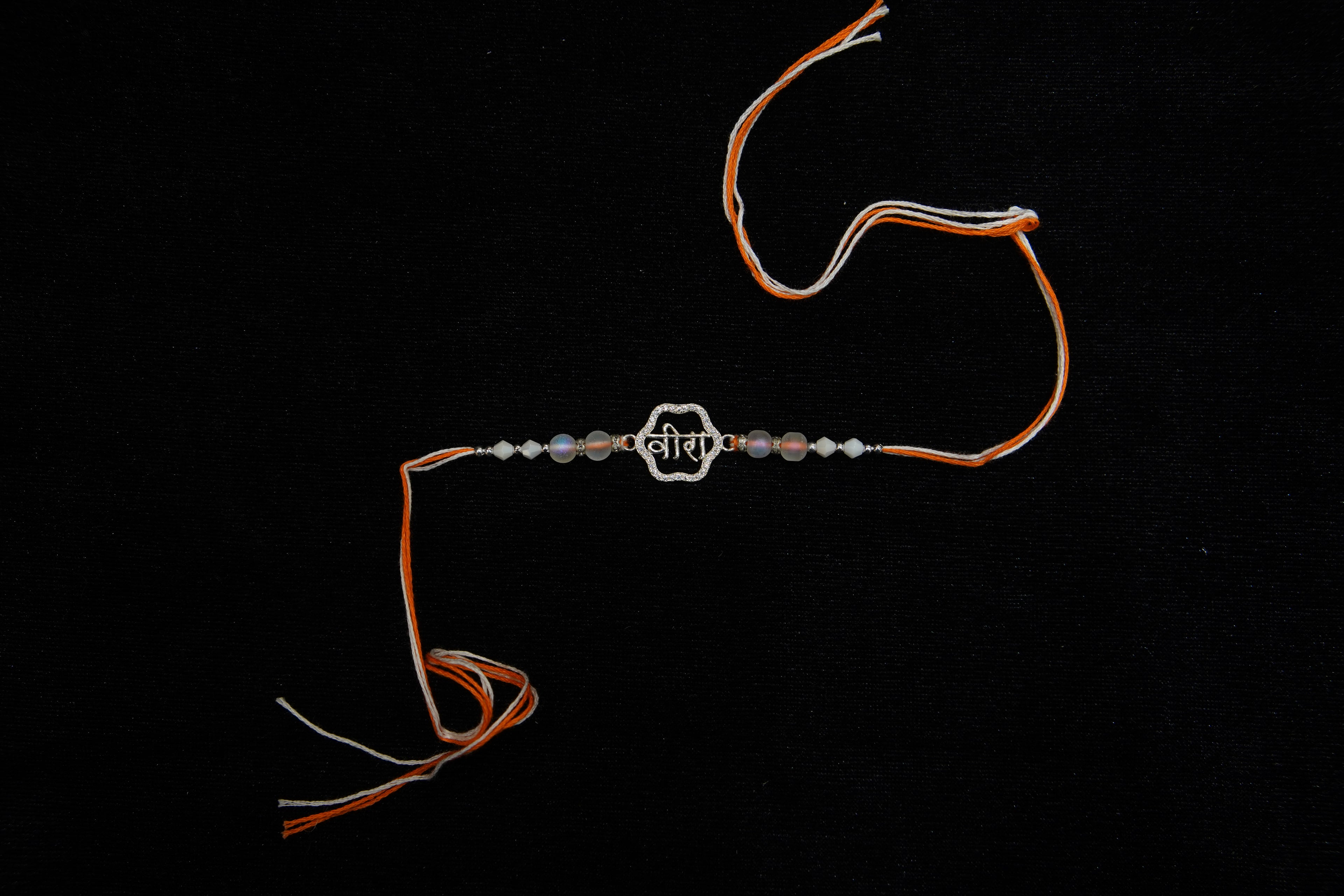Silver Rakhi with Roli Chawal