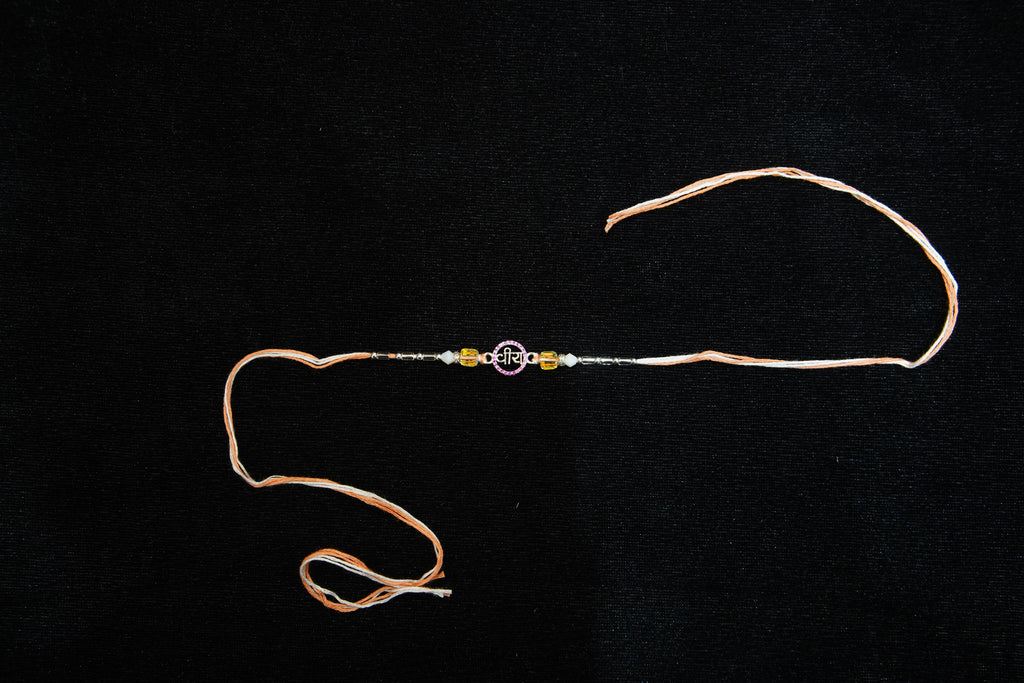 Silver Rakhi with Roli Chawal