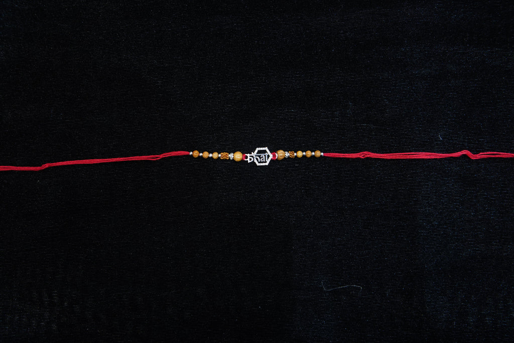 Silver Rakhi with Roli Chawal