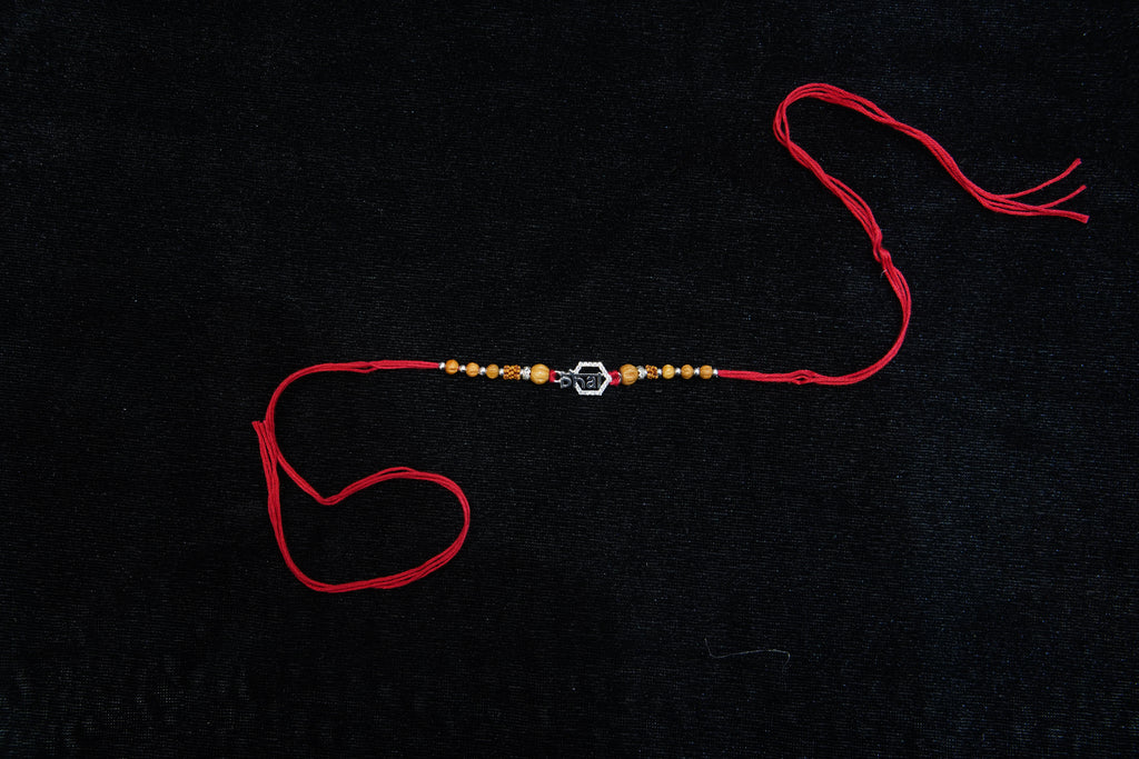 Silver Rakhi with Roli Chawal