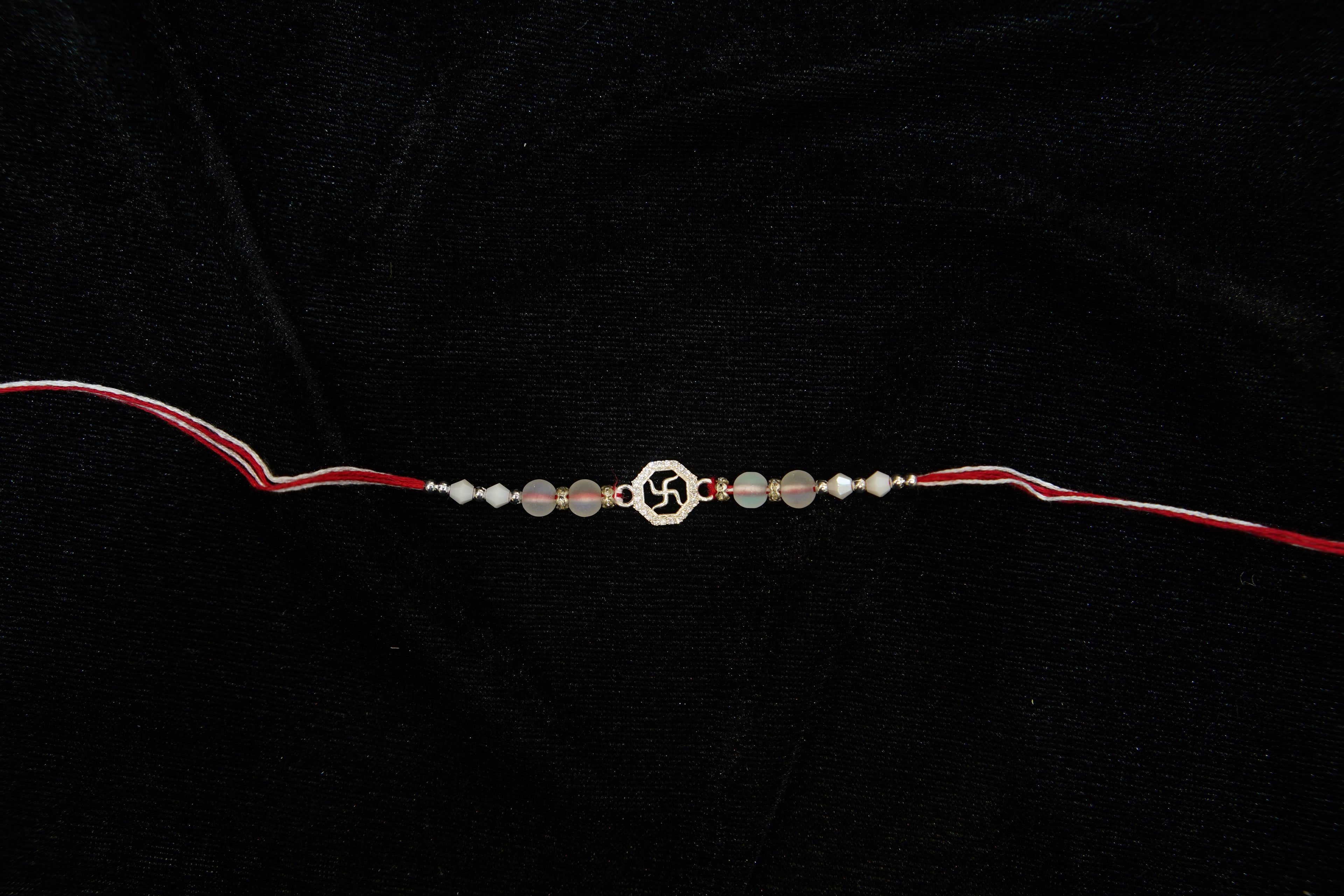 Silver Rakhi with Roli Chawal