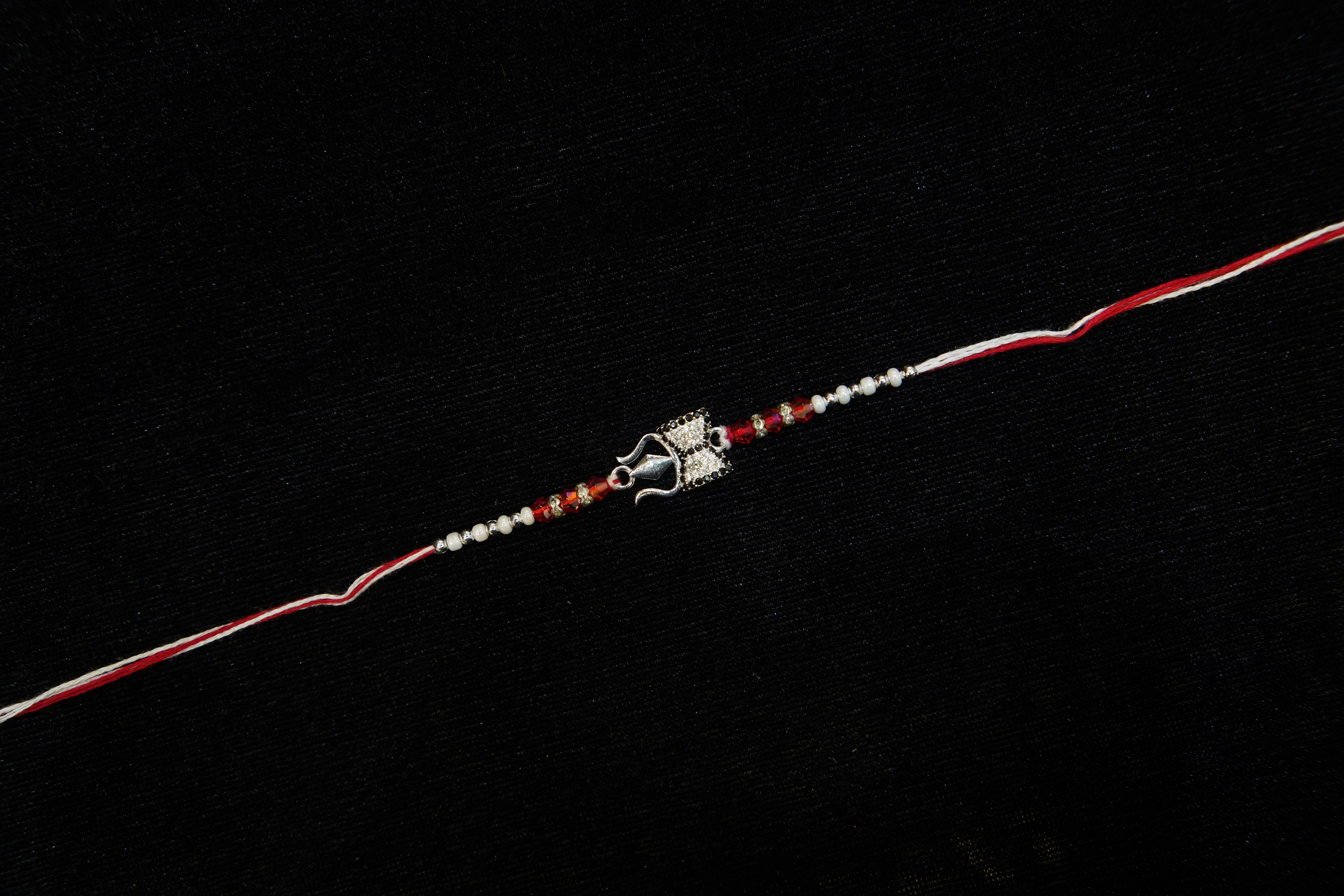 Silver Rakhi with Roli Chawal