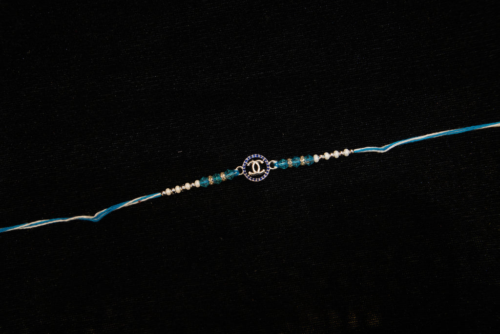 Silver Rakhi with Roli Chawal