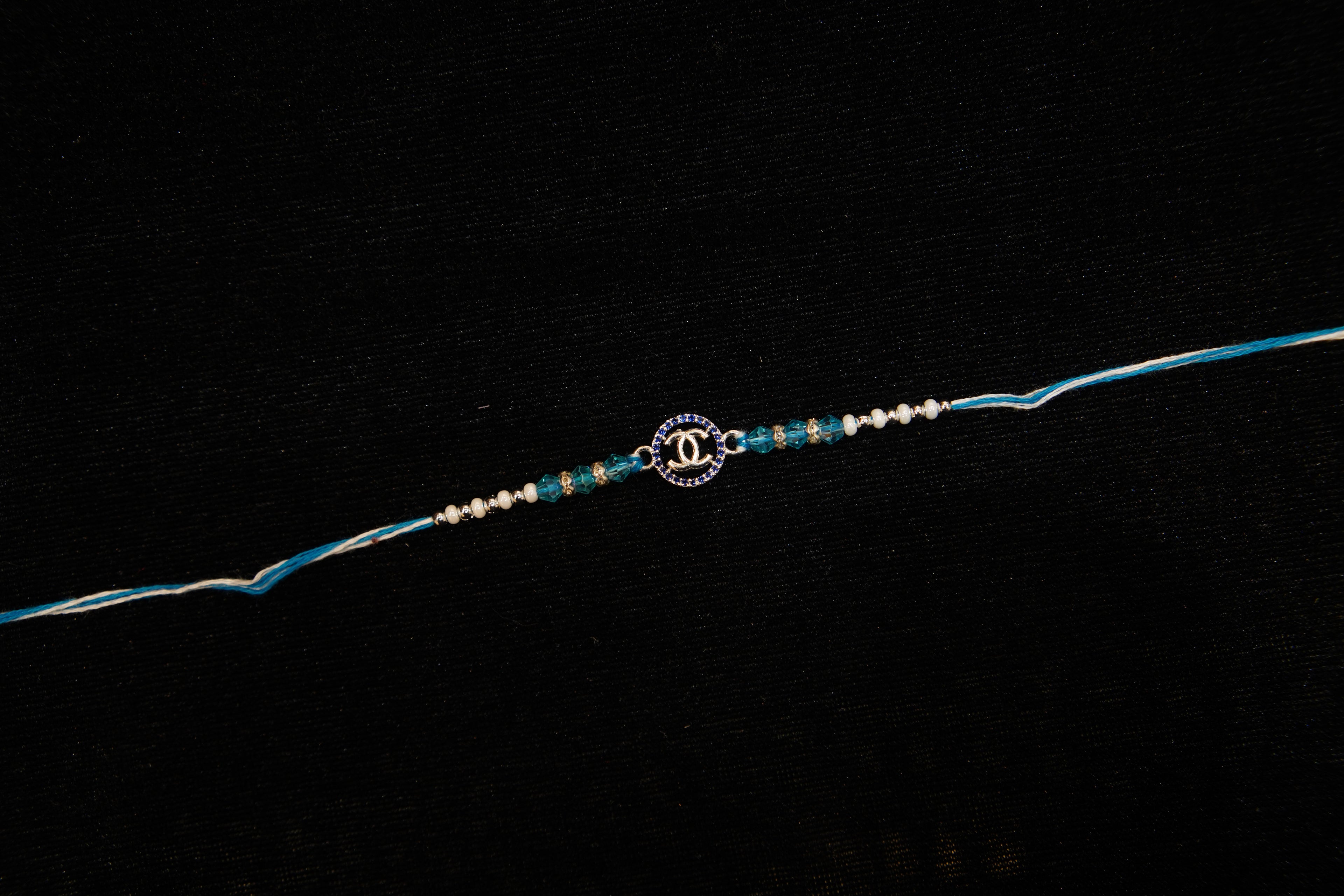 Silver Rakhi with Roli Chawal