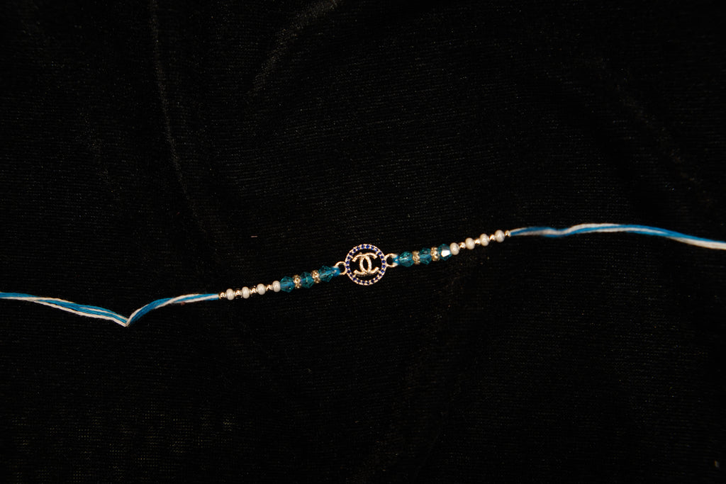 Silver Rakhi with Roli Chawal