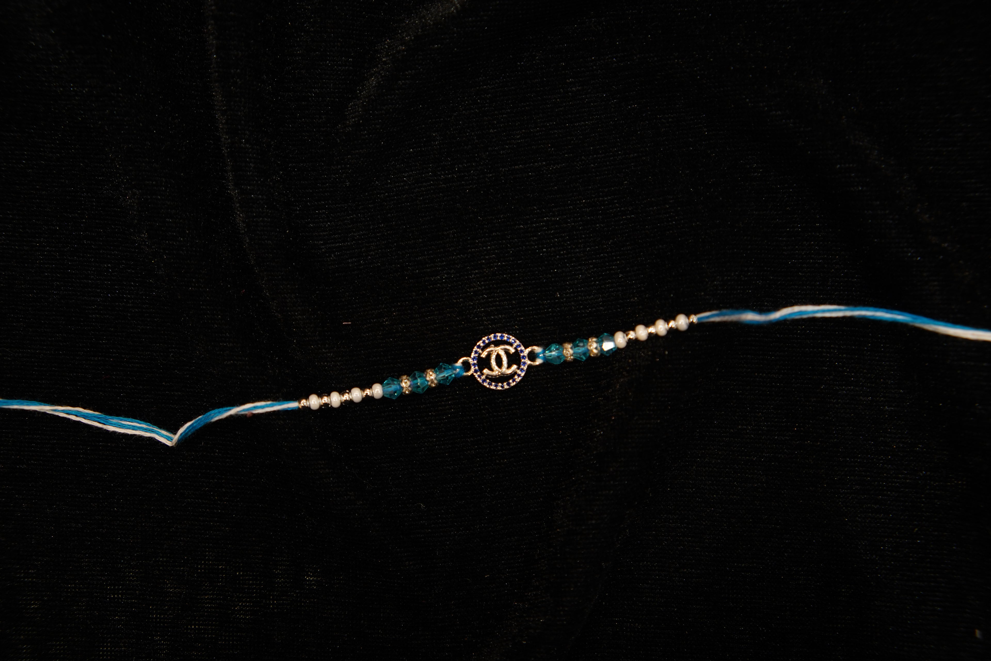Silver Rakhi with Roli Chawal