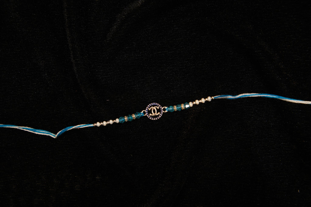 Silver Rakhi with Roli Chawal