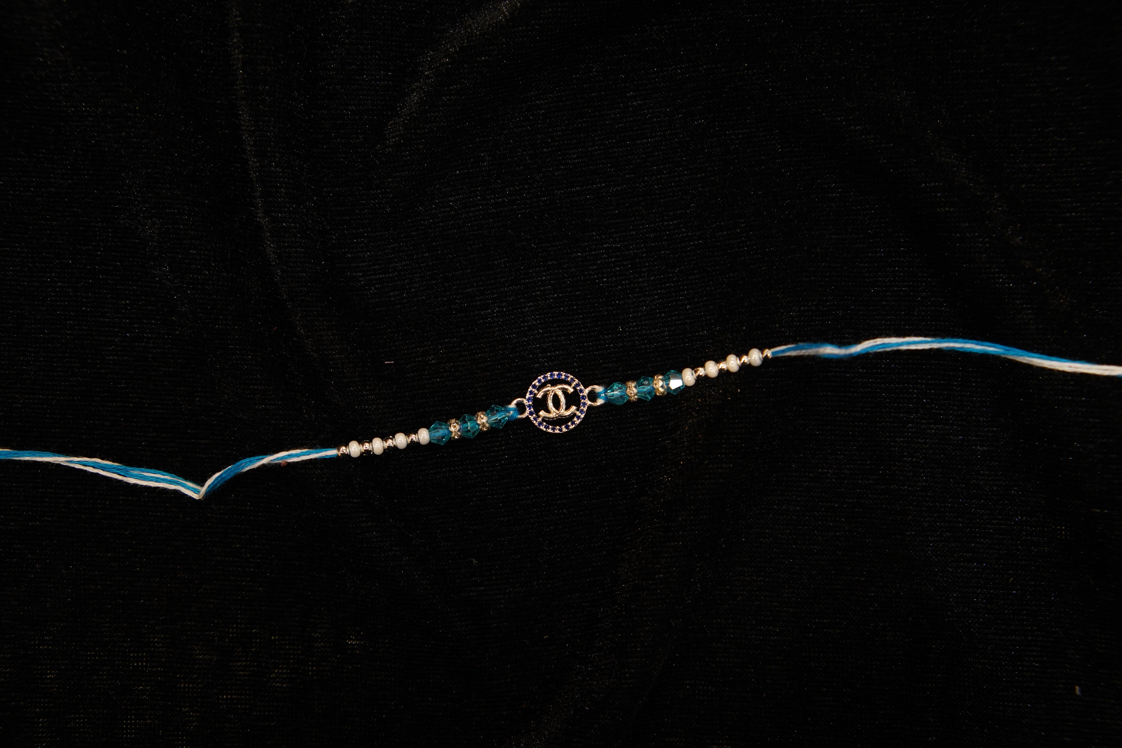 Silver Rakhi with Roli Chawal