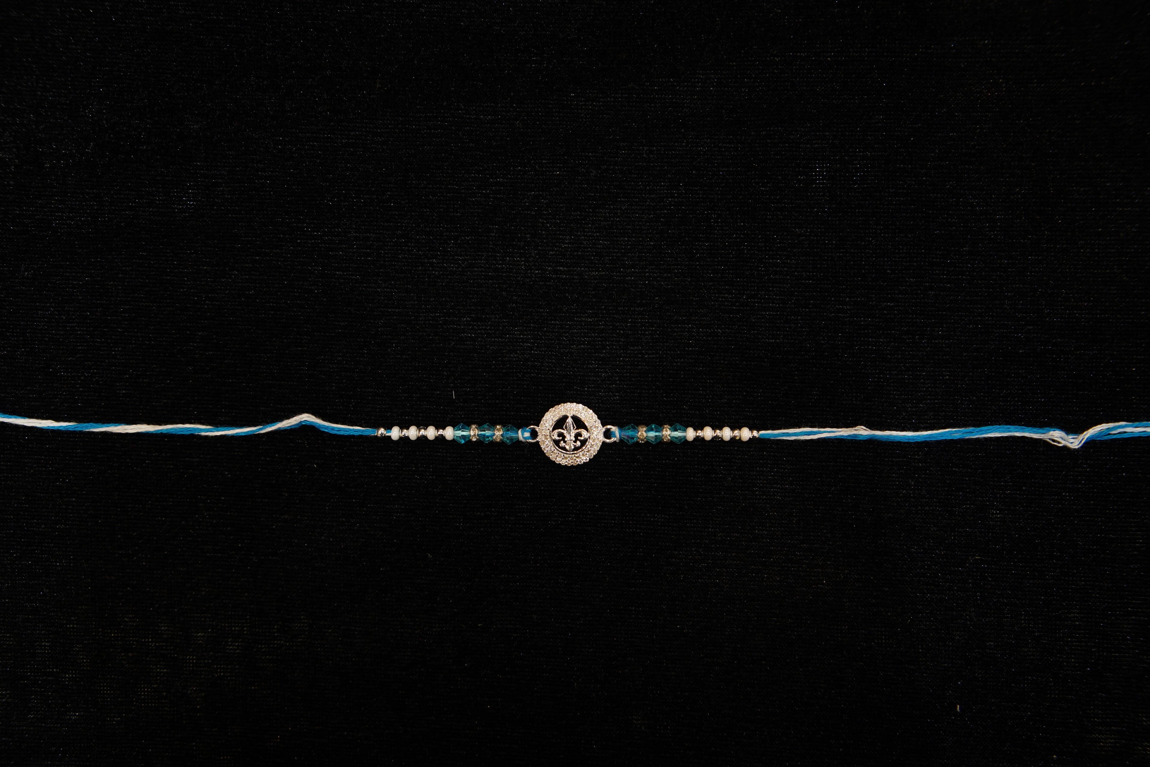 Silver Rakhi with Roli Chawal