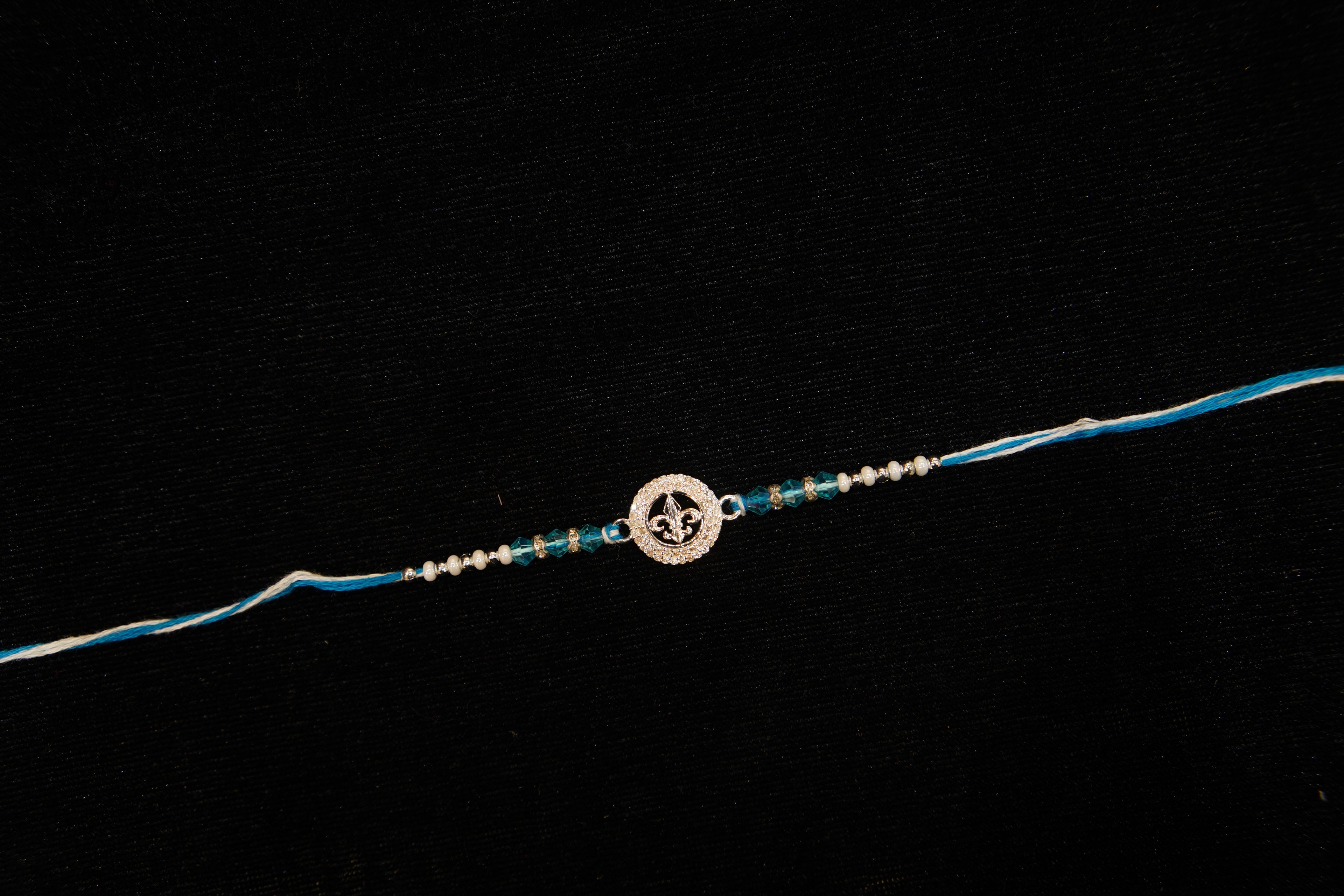 Silver Rakhi with Roli Chawal
