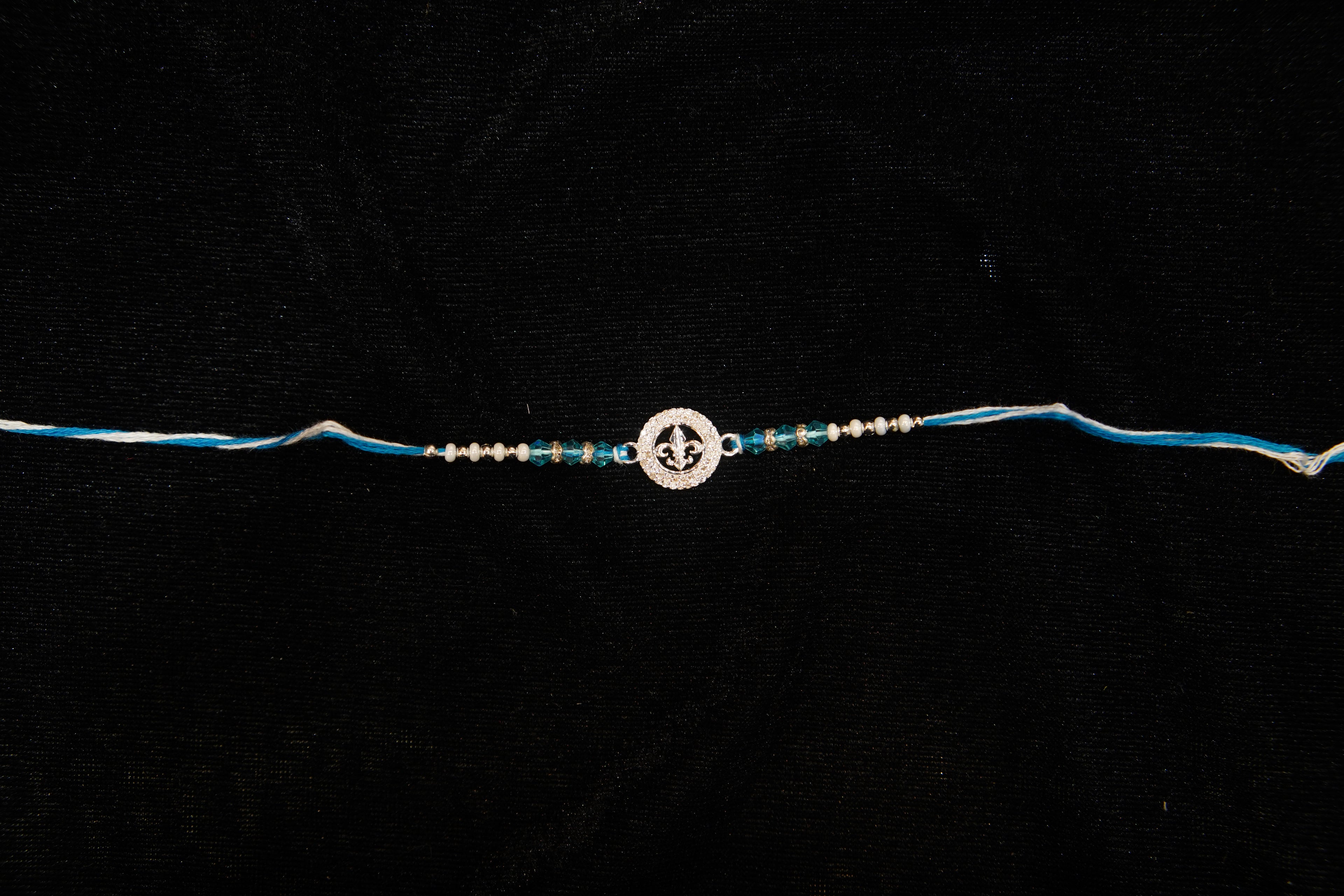Silver Rakhi with Roli Chawal