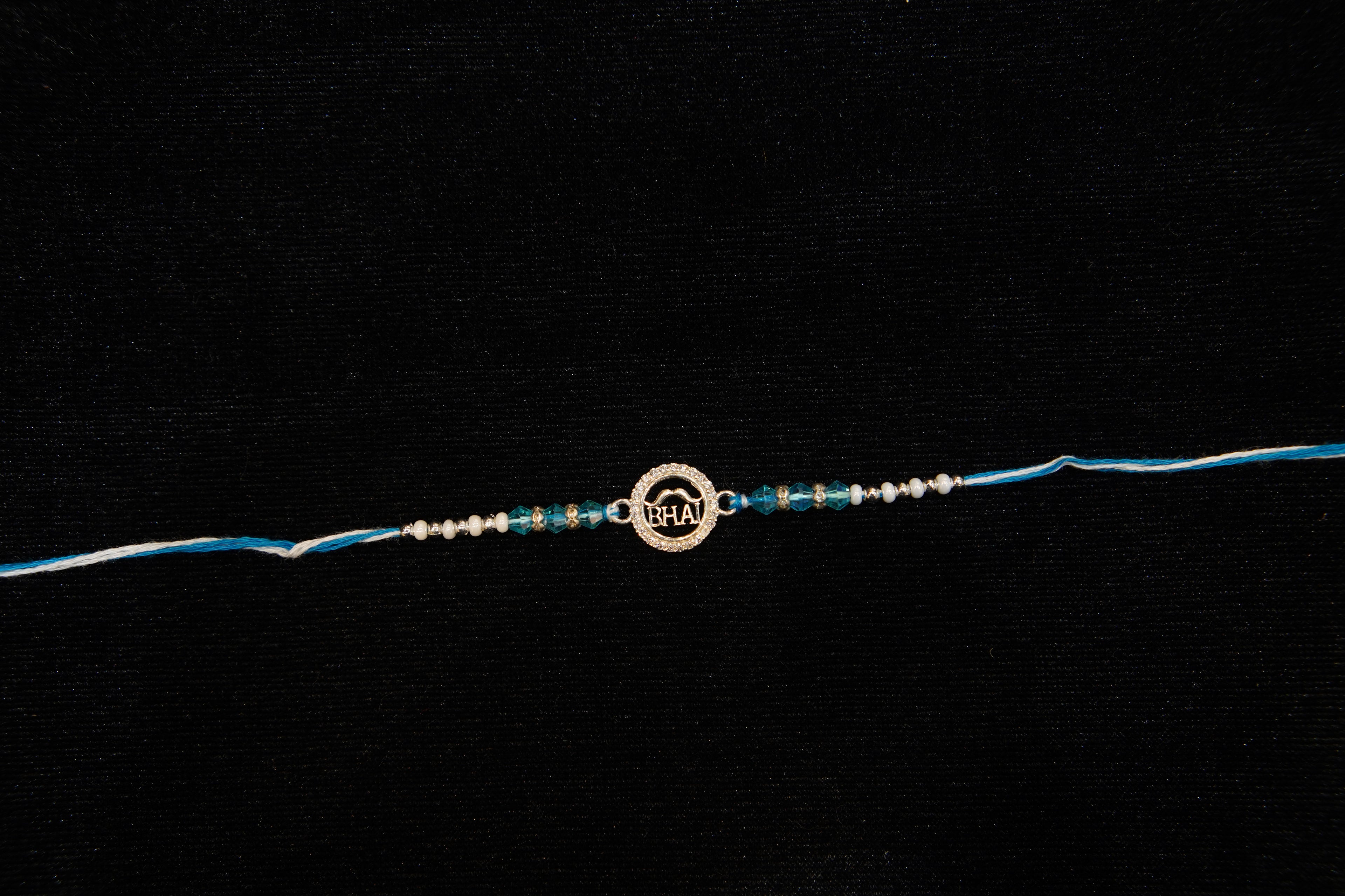 Silver Rakhi with Roli Chawal