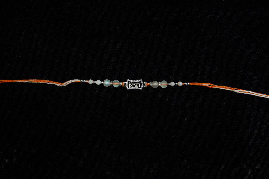Silver Rakhi with Roli Chawal