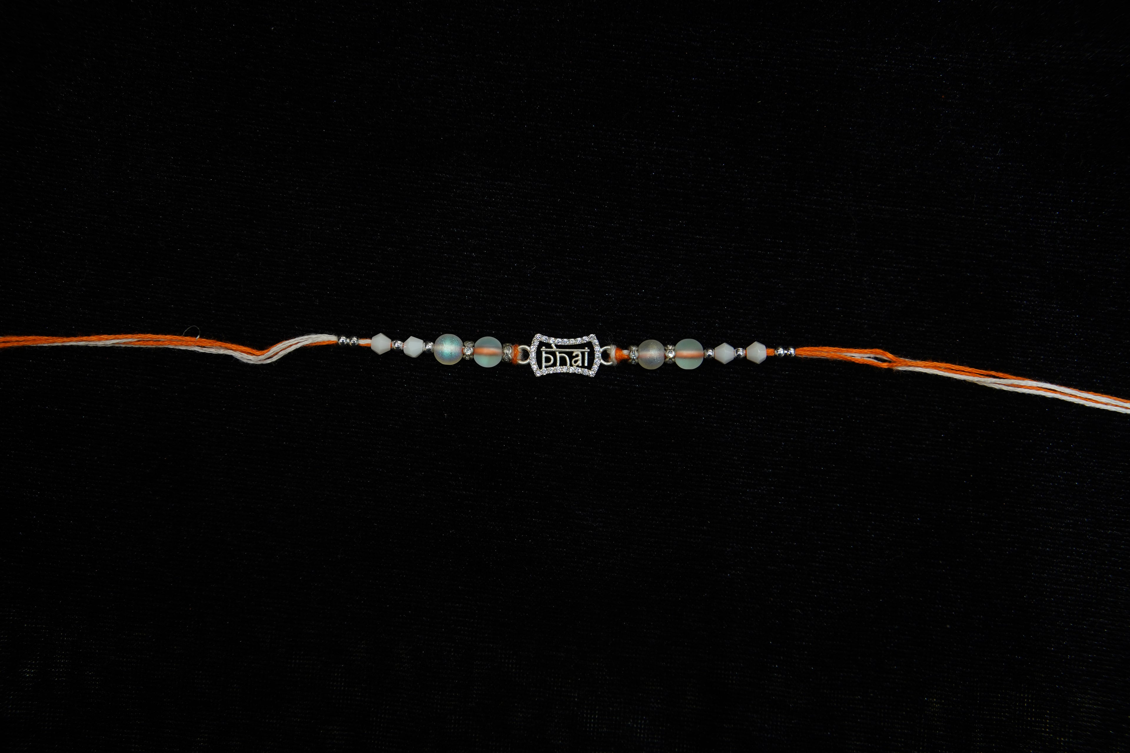 Silver Rakhi with Roli Chawal