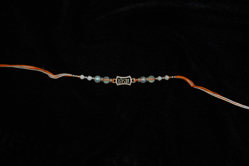Silver Rakhi with Roli Chawal