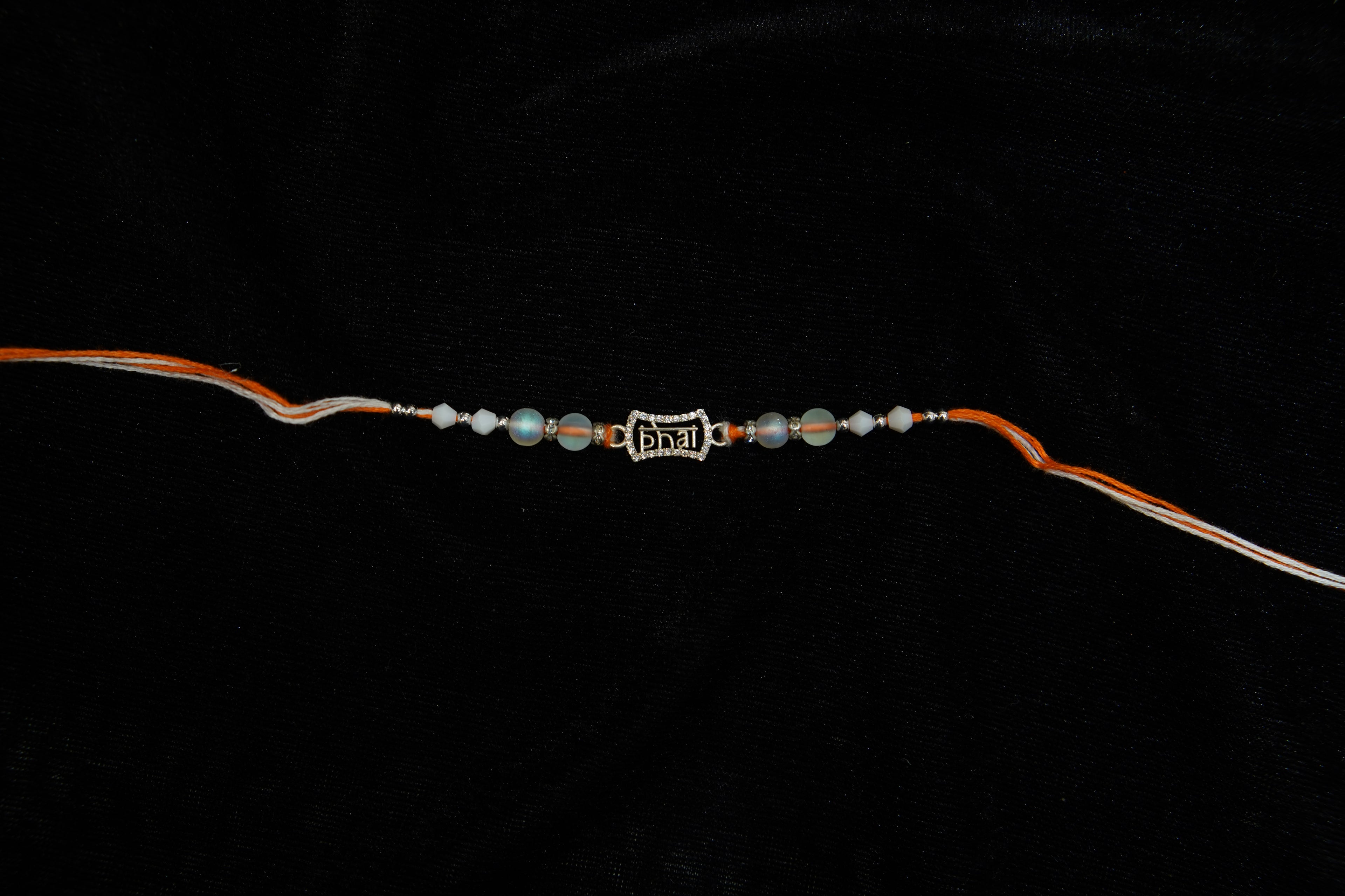 Silver Rakhi with Roli Chawal