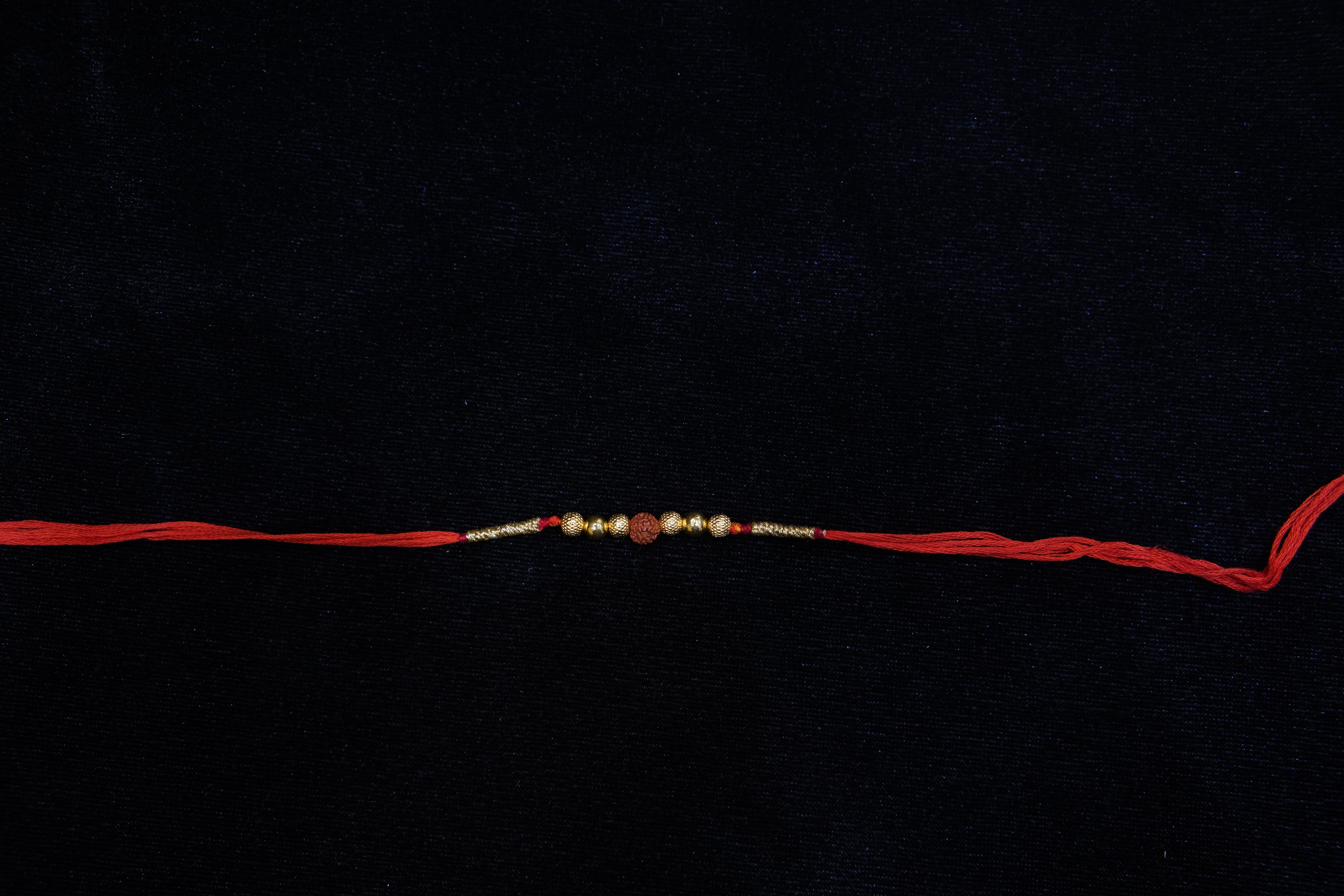 Silver Rakhi with Roli Chawal