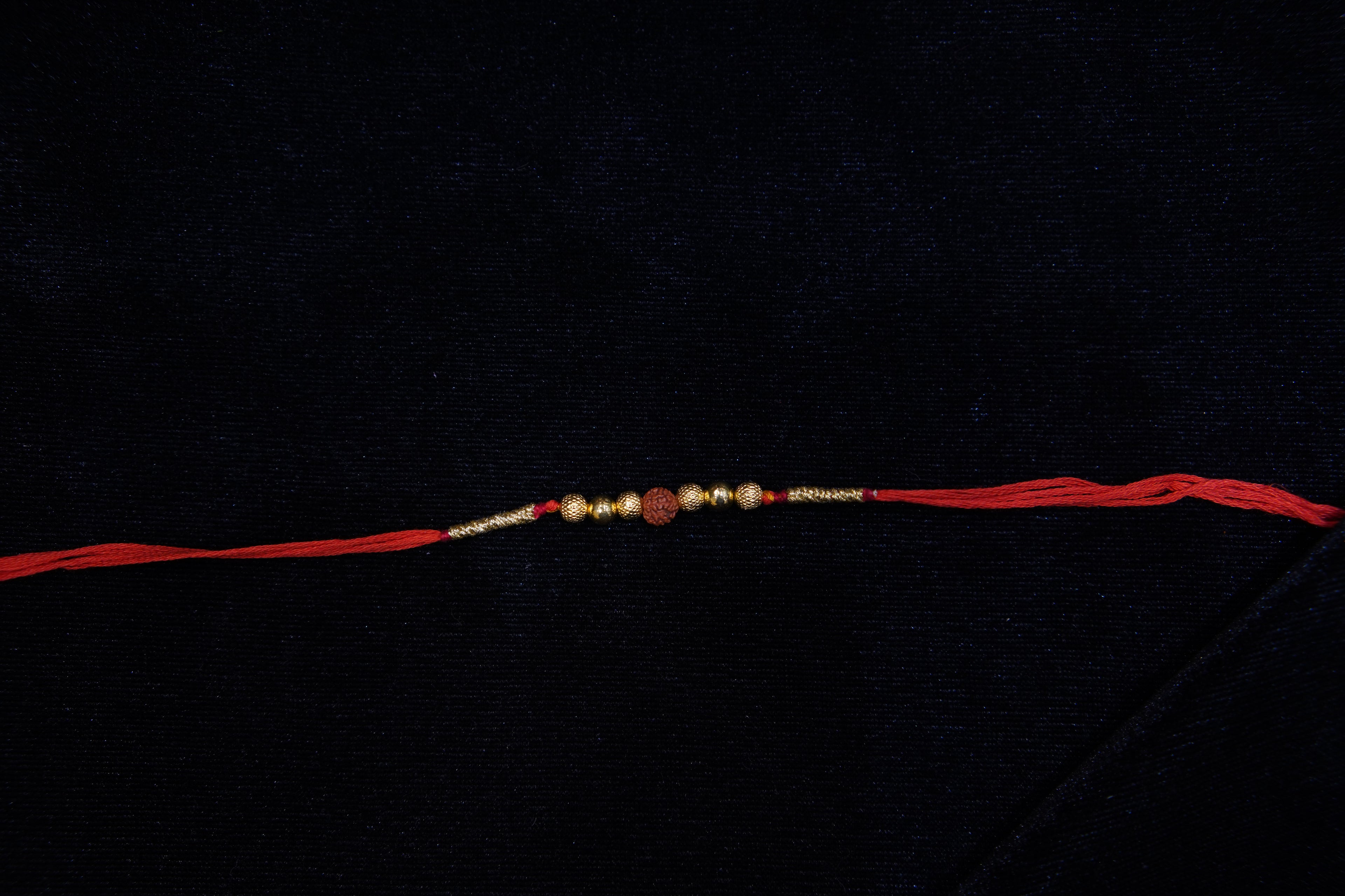 Silver Rakhi with Roli Chawal