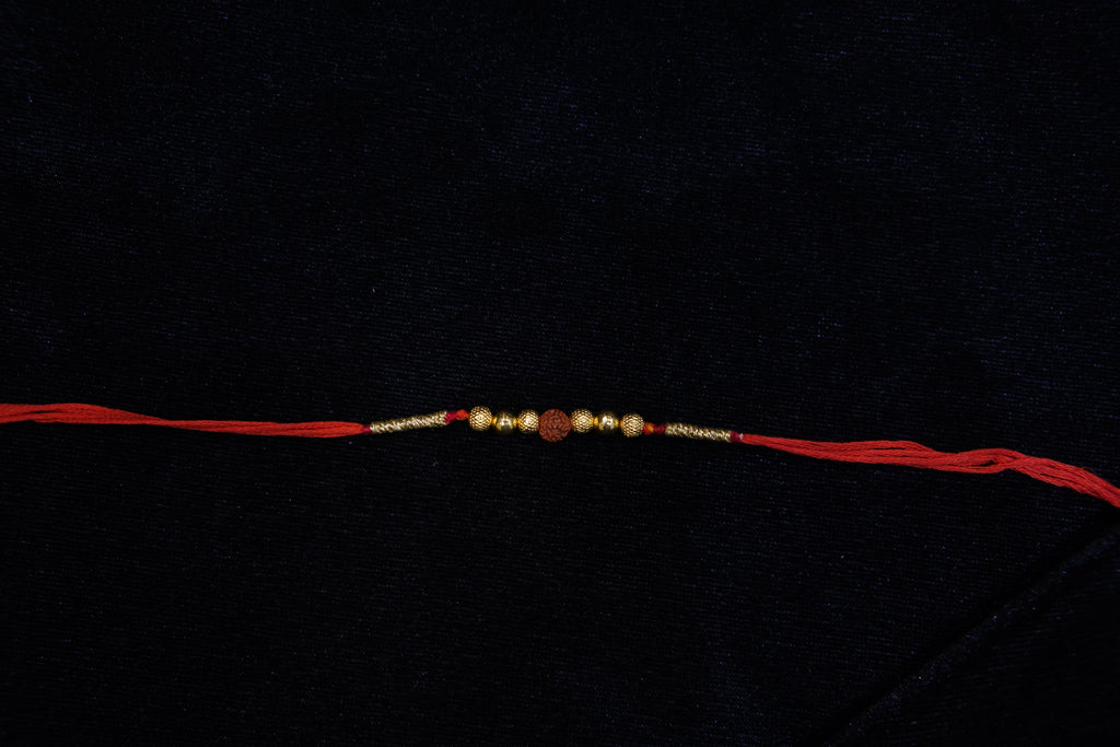 Silver Rakhi with Roli Chawal